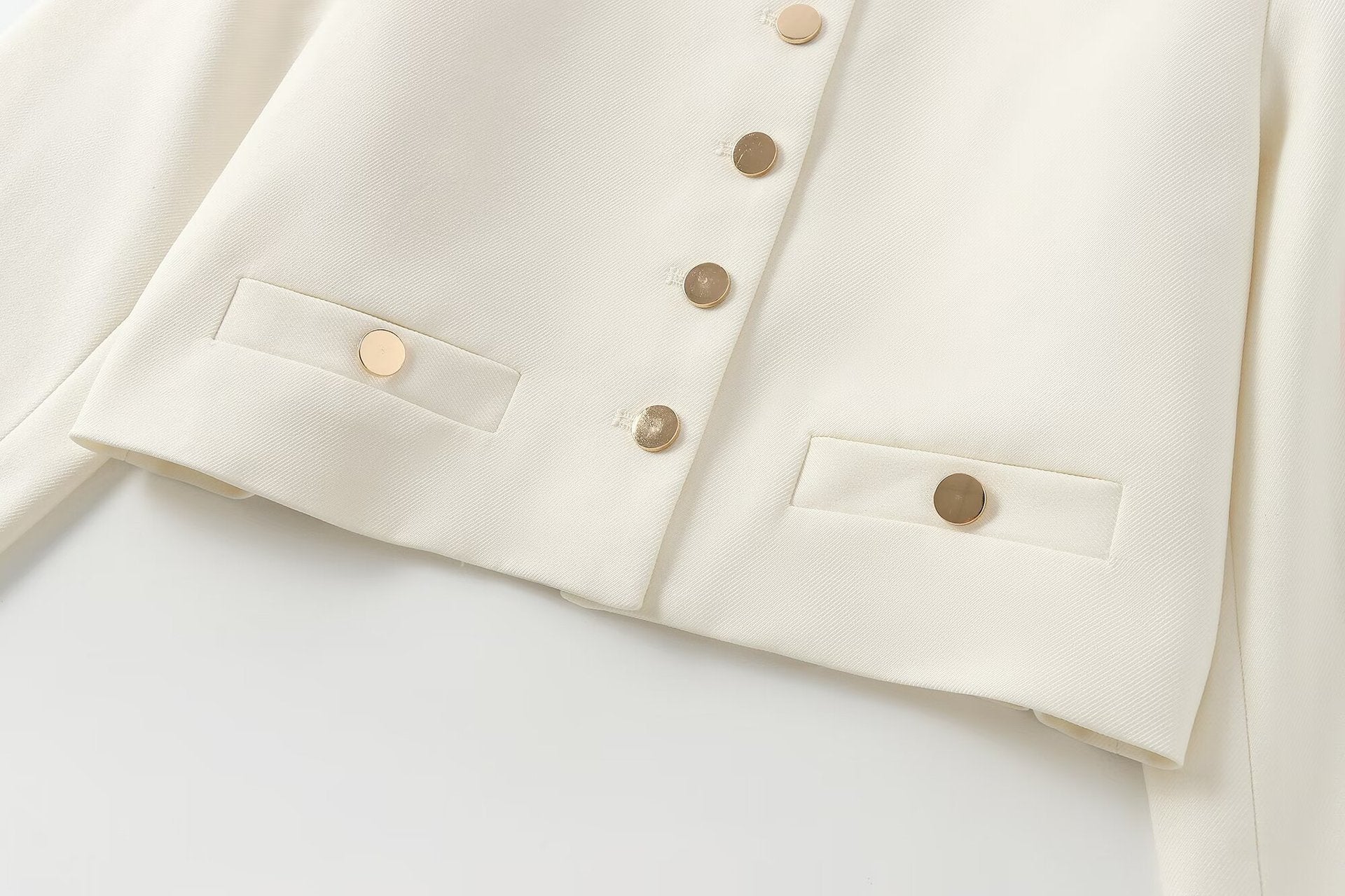 Veste courte à col rond boutonnée